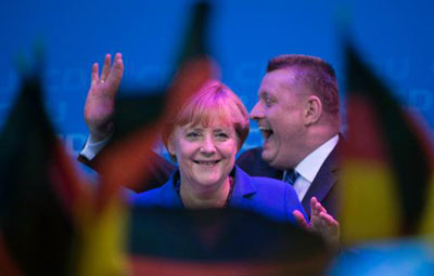 Imprensa mundial v vitria de Merkel como um 