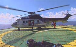 Buscas por desaparecidos em acidente de helicptero continua