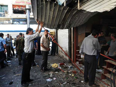 Bombas matam 14 no centro de Damasco, diz TV sria